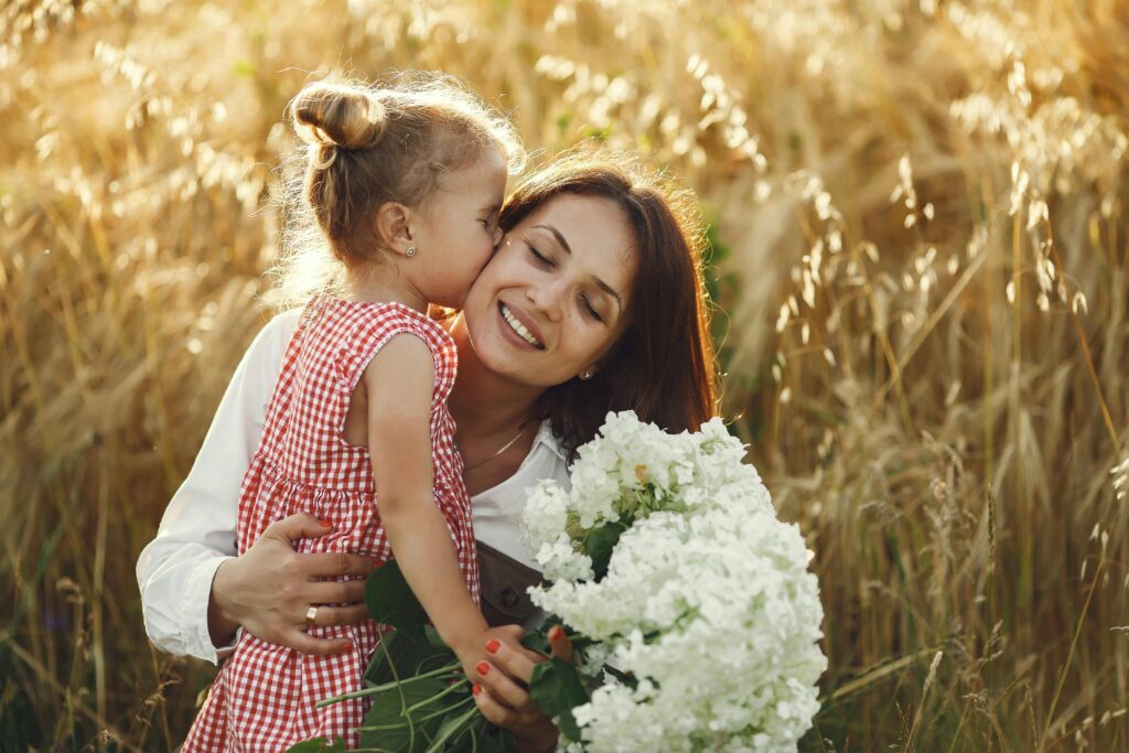 little girl kiss her mother